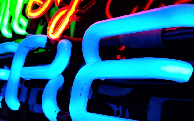 Colorful neon glass tubes of advertising text signs for professional writing services for web and advertising